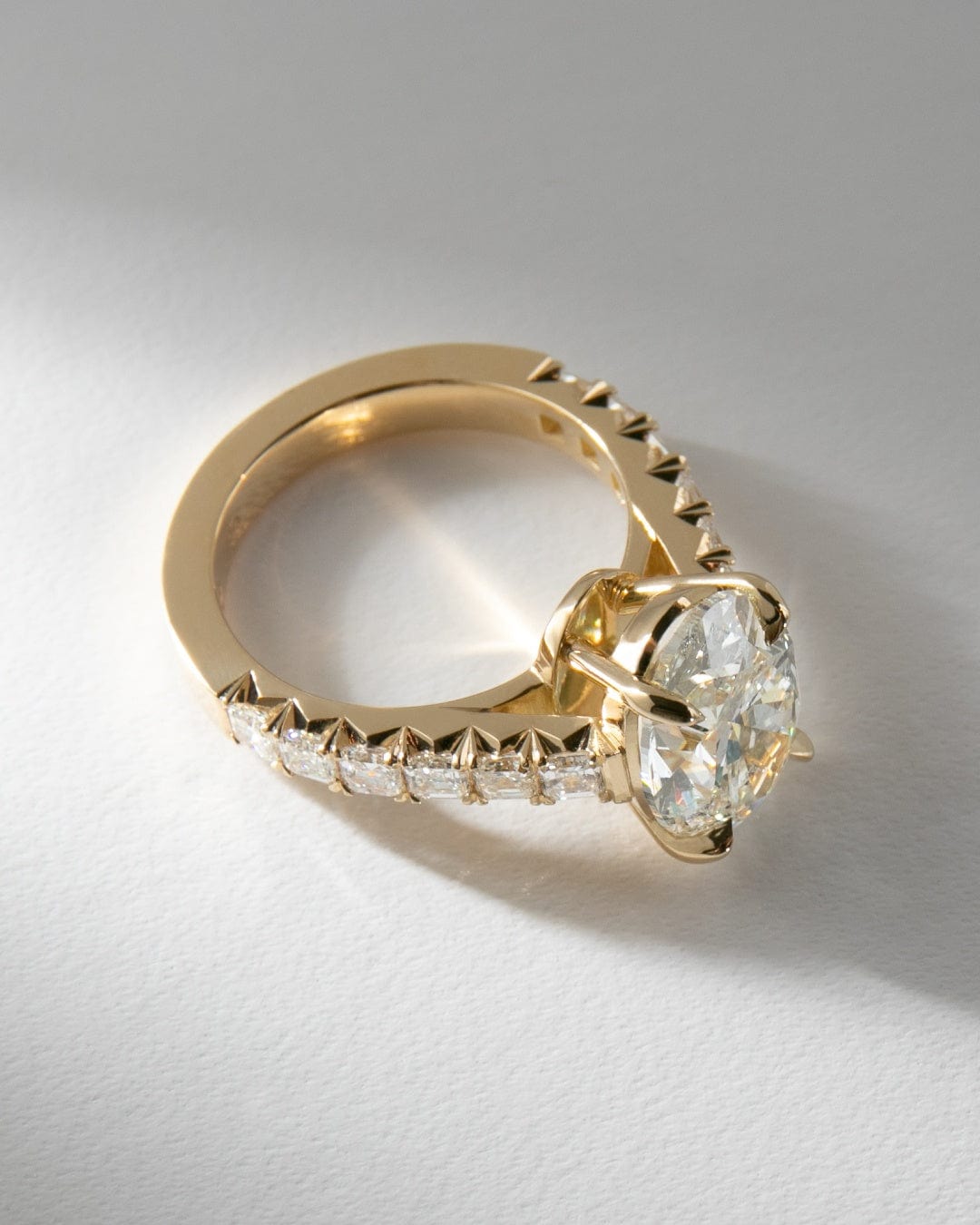Oval Solitaire with Asscher Cut Diamond Band
