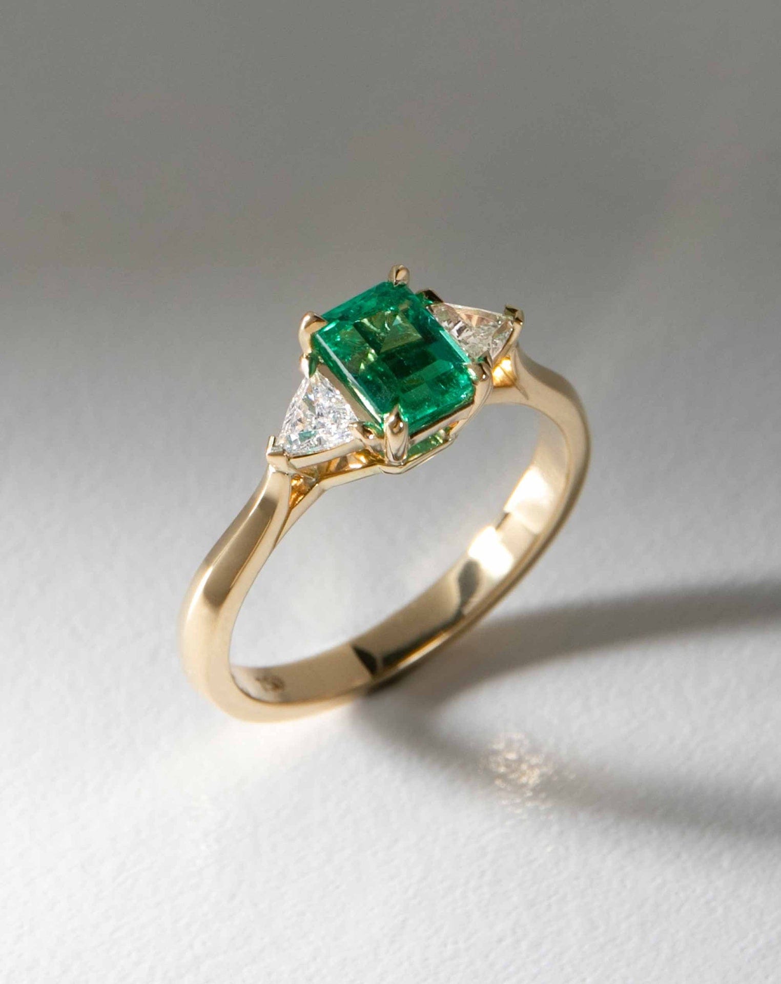 Octagonal Emerald Flanked by Diamond Trillions