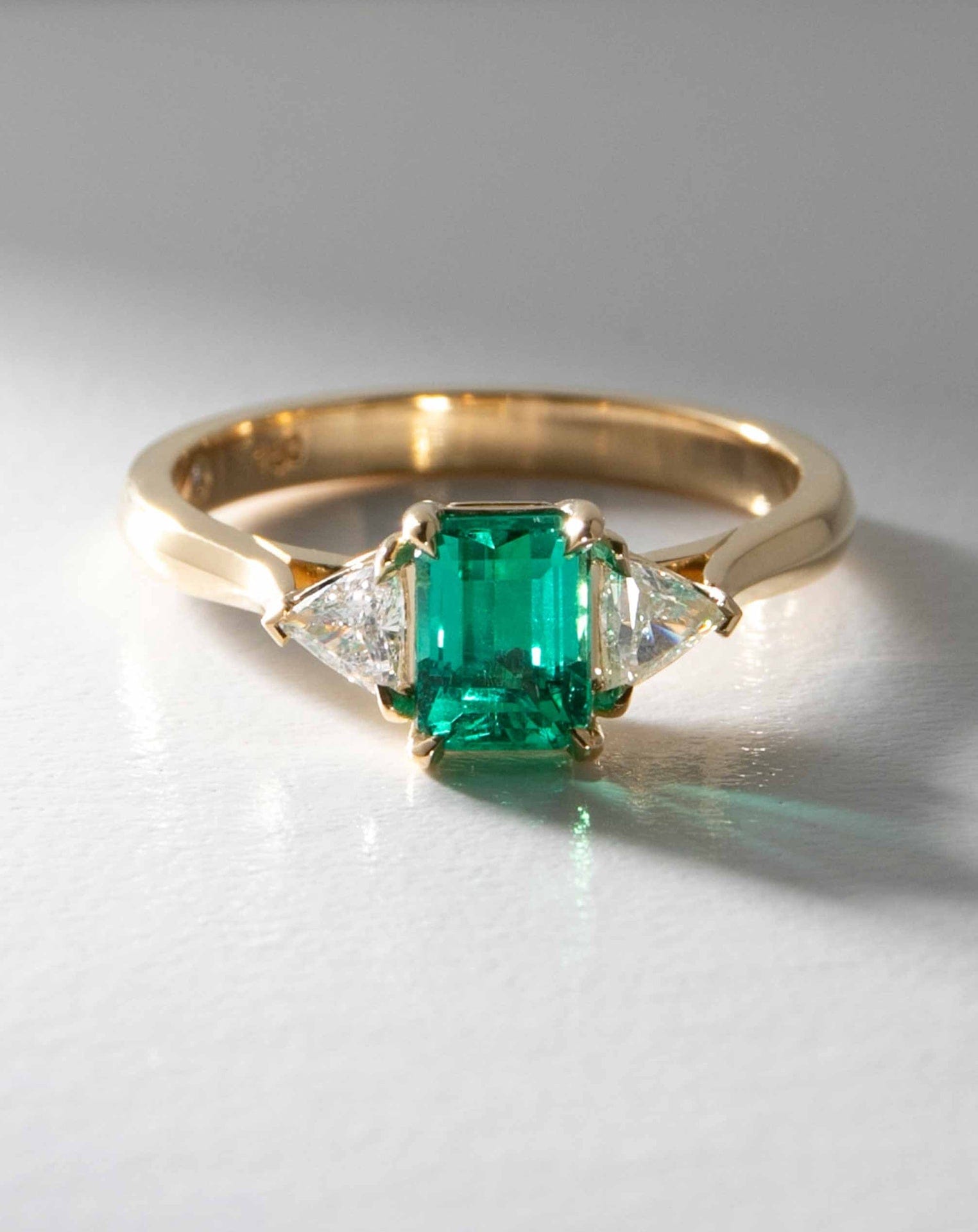 Octagonal Emerald Flanked by Diamond Trillions